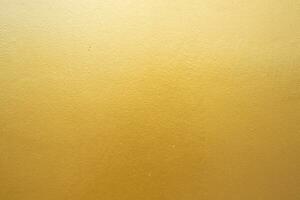 Gold concrete wall on background texture. photo
