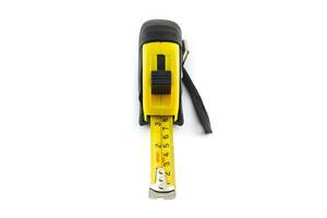 Yellow tape measure or steel tape isolated white background. photo