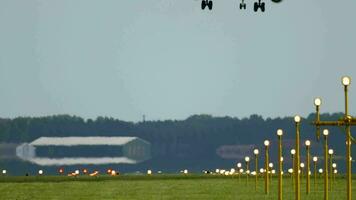 AMSTERDAM, THE NETHERLANDS JULY 27, 2017 - Slow motion plane of KLM Airlines landing at Schiphol airport, rear view. Runway and landing light video