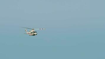 Helicopter takeoff and climb, front view, long shot. Flying helicopter in the sky video