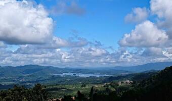 Aerial view of a valley with beautiful blue sky and clouds photo