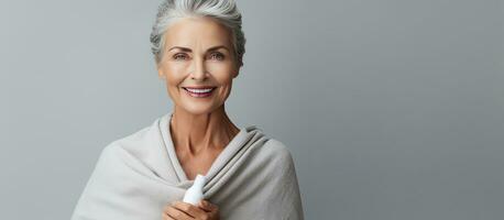 Elderly lady holding chapstick and smiling photo