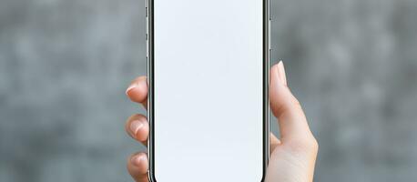 View of women s hands holding a cell phone with a blank screen photo