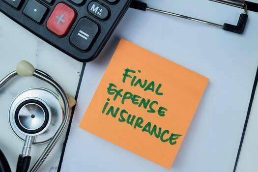Concept of Final Expense Insurance write on sticky notes with stethoscope and calculator isolated on Wooden Table. photo