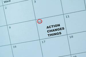 Concept of Date on a calendar with text Action Changes Things photo