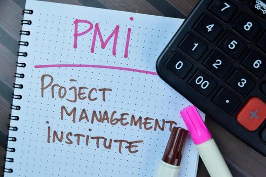 Concept of PMI - Project Management Institute write on book isolated on Wooden Table. photo