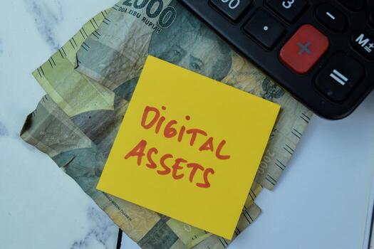 Concept of Digital Assets write on sticky notes isolated on Wooden Table. photo