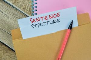 Sentence Structure text with document brown envelope isolated on office desk photo