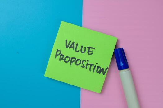 Concept of Value Proposition write on sticky notes isolated on Wooden Table. photo