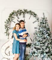 Christmas Couple.Happy Smiling Family at home celebrating.New Year People photo