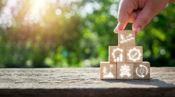 KAIZEN concept, Person hand holding wooden block with kaizen icon on virtual screen, Business philosophy and corporate strategy concept of continual improvement. photo