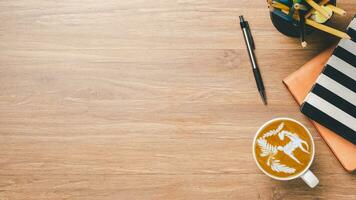 Top view, Office desk with notebook, pen and Cup of coffee, copy space, Mock up. photo