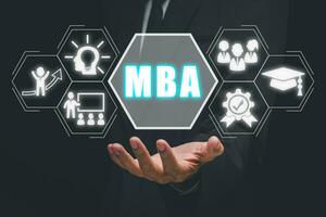 MBA, Master of business administration Education concept, Business person hand holding Master of business administration icon on virtual screen. photo