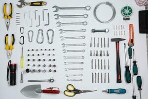 Set of tools for repair in a case on a white background. Assorted work or construction tools. Wrenches, Pliers, screwdriver. Top view photo