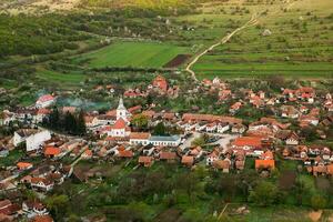 Rimetea is a small village located in Transylvania, Romania. It is situated in the Apuseni Mountains and is known for its picturesque setting and well preserved Hungarian architectural style. photo