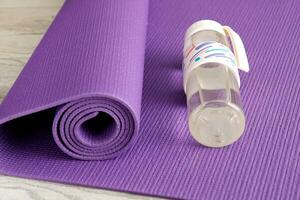 water bottle on gymnastic mat, sports activities photo