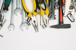 Set of tools for repair in a case on a white background. Assorted work or construction tools. Wrenches, Pliers, screwdriver. Top view photo