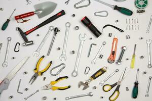 Set of tools for repair in a case on a white background. Assorted work or construction tools. Wrenches, Pliers, screwdriver. Top view photo