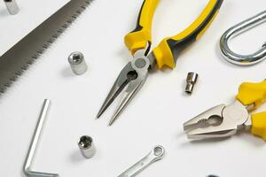 Set of tools for repair in a case on a white background. Assorted work or construction tools. Wrenches, Pliers, screwdriver. Top view photo