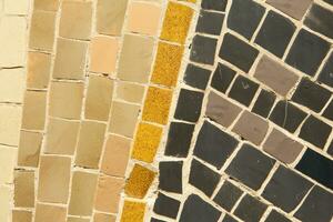 Colorful ceramic mosaic on the walls of the building. Abstract background and texture for design. photo