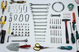 Set of tools for repair in a case on a white background. Assorted work or construction tools. Wrenches, Pliers, screwdriver. Top view photo