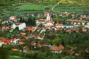 Rimetea is a small village located in Transylvania, Romania. It is situated in the Apuseni Mountains and is known for its picturesque setting and well preserved Hungarian architectural style. photo