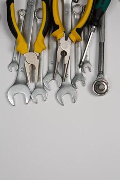Set of tools for repair in a case on a white background. Assorted work or construction tools. Wrenches, Pliers, screwdriver. Top view photo