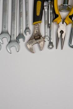 Set of tools for repair in a case on a white background. Assorted work or construction tools. Wrenches, Pliers, screwdriver. Top view photo