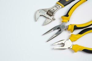 Set of tools for repair in a case on a white background. Assorted work or construction tools. Wrenches, Pliers, screwdriver. Top view photo