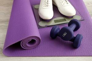 gymnastic mat, scales, sneakers, dumbbells, sports at home photo