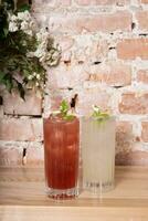 Summer lemonades with ice and mint in glass glasses. photo