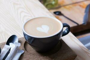 Cup of latte art in the shape of a heart photo
