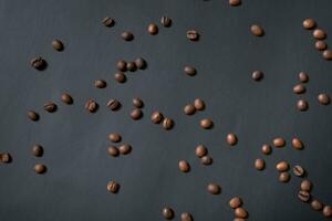 Coffee beans on black background top view photo