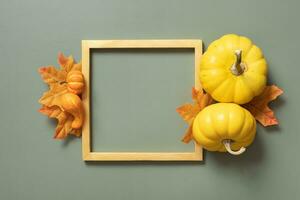 Gold frame with decorative pumpkin. Autumn minimalist aesthetic concept photo