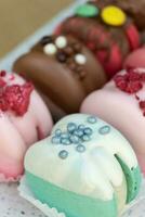 Colored macaroons with decoration for those with a sweet tooth close up. photo