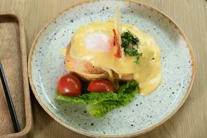 Toast with egg, ham and cheese under bechamel sauce. Delicious breakfast in the restaurant photo