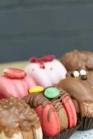 Colored macaroons with decoration for those with a sweet tooth close up. photo