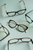 Stylish eyeglasses on colored background. Optical store, vision test, stylish glasses concept. photo