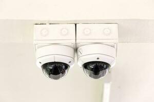 Twin CCTV security camera on ceiling. photo