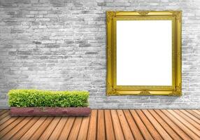 Blank frame vintage on a concrete wall with tree pot on wood floor photo