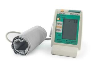 Digital blood pressure machine gauge isolated on white background. photo