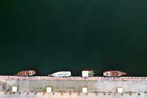 Aerial View by Drone of yachts or small boats.  Yacht and boats are moored at the quay. Parking photo