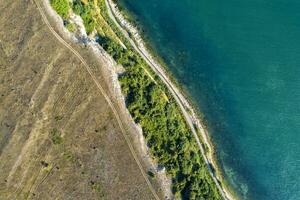 Beauty sea and steep coastline surface aerial top view from the drone. photo