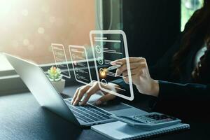 Business performance checklist, businessman using laptop doing online checklist survey, Check marks on checklist and Filling online form or answering questions. evaluation, online survey, online exam. photo