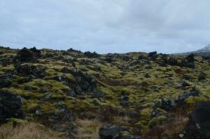 Rocky lava field with large volcanic rocks photo