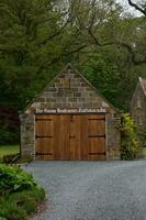 Wooden Shed with a Wood Garage Door photo