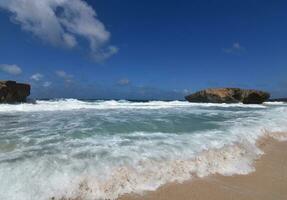 Scenic Views of Waves Rolling Ashore in Aruba photo