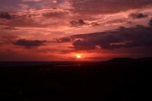 Stunning Pink Sunrise Over the Ocean in Aruba photo