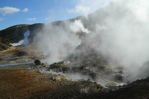 Geothermal Hot Steam Vapors Rising from Volcanic Activity photo