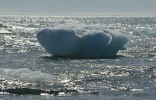 Single iceberg floe in the ocean in Iceland photo